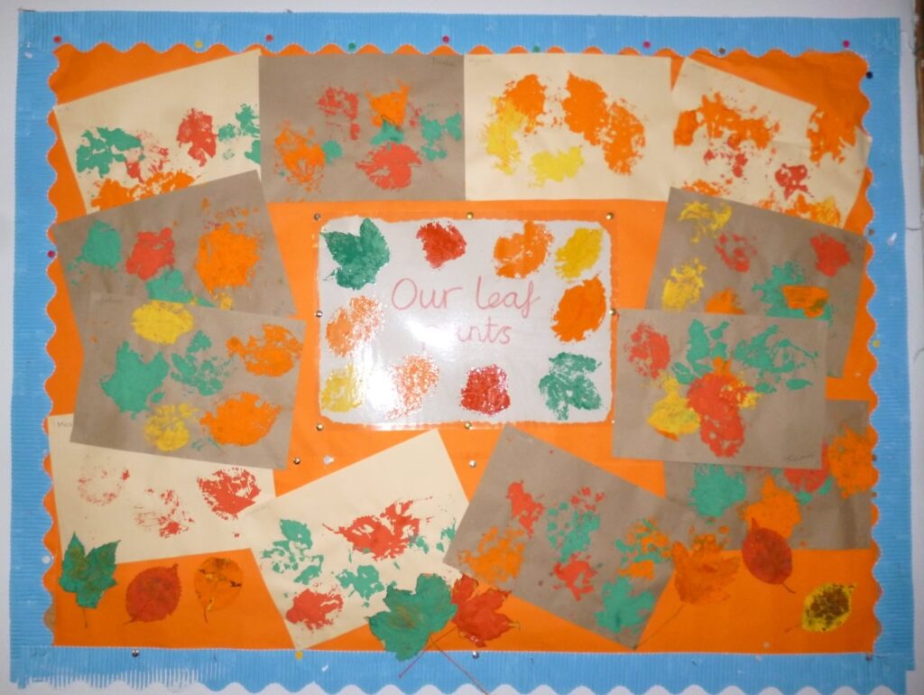 notice board displaying leaf print paintings