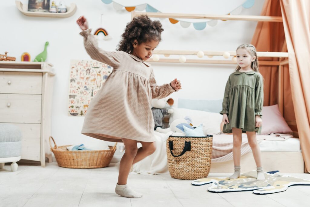 Photo of Girls Playing Inside the Playroom