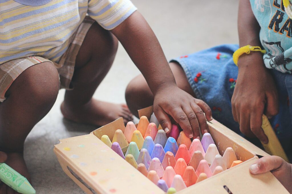 child selecting paints from a box
